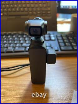 DJI Osmo Pocket + controller wheel in excellent condition And Docking Station