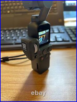 DJI Osmo Pocket + controller wheel in excellent condition And Docking Station
